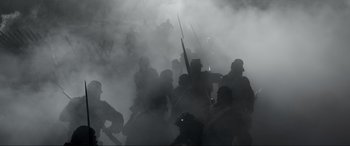 Movie still from “Emancipation” (2022), directed by Antoine Fuqua – A large group of people are gathered in the fog; Wide shot, Low angle