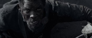 Movie still from “Emancipation” (2022), directed by Antoine Fuqua – A person with a beard; Close Up shot, Low angle