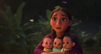 Movie still from “Encanto” (2021), directed by Charise Castro Smith – A woman holding three dolls in her arms; Medium shot, Low angle
