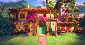 Movie still from “Encanto” (2021), directed by Charise Castro Smith – A painting of a house with a green door and pink flowers; Extreme Wide shot, High angle
