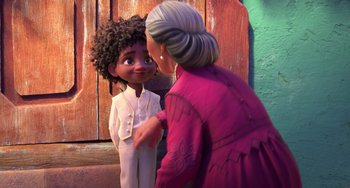 Movie still from “Encanto” (2021), directed by Charise Castro Smith – A woman and a boy are talking to each other; Medium shot, Over the shoulder angle