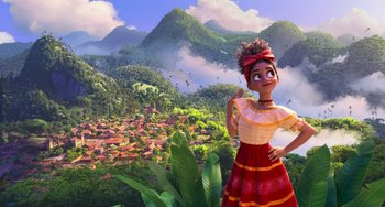 Movie still from “Encanto” (2021), directed by Charise Castro Smith – An animated character stands in front of a lush green landscape; Wide shot, Low angle