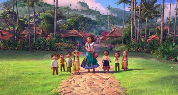 Movie still from “Encanto” (2021), directed by Charise Castro Smith – A group of people standing on a dirt path; Wide shot, Low angle