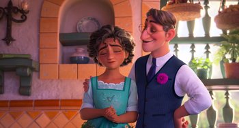 Movie still from “Encanto” (2021), directed by Charise Castro Smith – A man and a woman standing next to each other; Medium shot, Over the shoulder angle