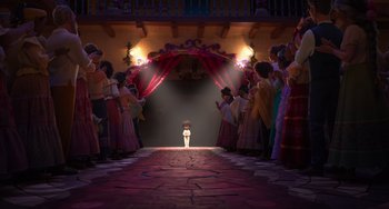 Movie still from “Encanto” (2021), directed by Charise Castro Smith – A group of people standing in front of a fire hydrant; Extreme Wide shot, Low angle