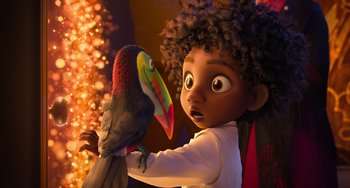 Movie still from “Encanto” (2021), directed by Charise Castro Smith – A young girl holding a colorful bird in her hands; Medium shot, Low angle