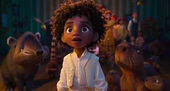 Movie still from “Encanto” (2021), directed by Charise Castro Smith – A young girl is standing in front of a group of people; Medium shot, Low angle