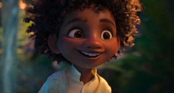 Movie still from “Encanto” (2021), directed by Charise Castro Smith – A young black boy's face; Close Up shot, Low angle