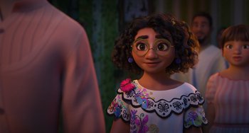 Movie still from “Encanto” (2021), directed by Charise Castro Smith – A young girl wearing a dress and a pair of glasses; Close Up shot, Over the shoulder angle