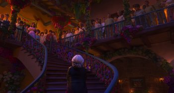 Movie still from “Encanto” (2021), directed by Charise Castro Smith – A group of people standing on a set of stairs; Wide shot, Low angle