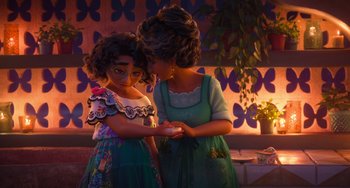 Movie still from “Encanto” (2021), directed by Charise Castro Smith – A woman and a child are looking at something; Medium shot, Over the shoulder angle