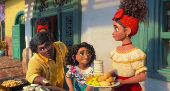 Movie still from “Encanto” (2021), directed by Charise Castro Smith – Two women and a little girl holding a plate of food; Medium shot, Over the shoulder angle