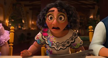Movie still from “Encanto” (2021), directed by Charise Castro Smith – An animated woman with a surprised look on her face; Close Up shot, Over the shoulder angle