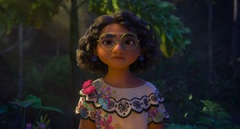 Movie still from “Encanto” (2021), directed by Charise Castro Smith – A young girl wearing glasses and a white dress; Close Up shot, Over the shoulder angle