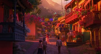 Movie still from “Encanto” (2021), directed by Charise Castro Smith – A group of people walking down a street near buildings; Extreme Wide shot, Low angle