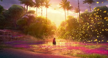 Movie still from “Encanto” (2021), directed by Charise Castro Smith – A person standing in a pool of water near trees; Extreme Wide shot, High angle