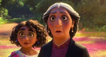 Movie still from “Encanto” (2021), directed by Charise Castro Smith – An old woman and a young girl looking surprised; Close Up shot, Over the shoulder angle