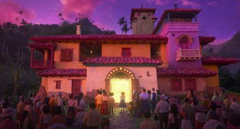 Movie still from “Encanto” (2021), directed by Charise Castro Smith – A group of people standing outside of a building; Extreme Wide shot, Low angle