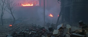 Movie still from “Enemy at the Gates” (2001), directed by Jean-Jacques Annaud – A group of soldiers in the middle of a fire; Wide shot, High angle
