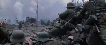 Movie still from “Enemy at the Gates” (2001), directed by Jean-Jacques Annaud – A group of soldiers in the middle of a battle; Wide shot, High angle