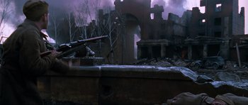 Movie still from “Enemy at the Gates” (2001), directed by Jean-Jacques Annaud – An image of an old building that has been burned down; Wide shot, Low angle