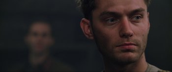 Movie still from “Enemy at the Gates” (2001), directed by Jean-Jacques Annaud – A man's face in a dark room; Close Up shot, Low angle