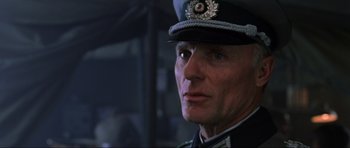 Movie still from “Enemy at the Gates” (2001), directed by Jean-Jacques Annaud – A person wearing a military uniform; Close Up shot, Low angle
