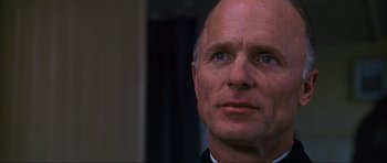 Movie still from “Enemy at the Gates” (2001), directed by Jean-Jacques Annaud – An older man is looking into the distance; Close Up shot, Low angle