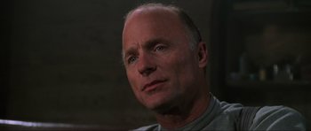 Movie still from “Enemy at the Gates” (2001), directed by Jean-Jacques Annaud – An older man is looking into the camera; Close Up shot, Low angle