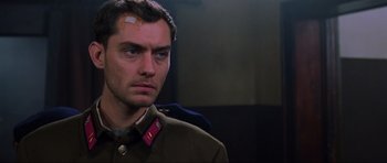 Movie still from “Enemy at the Gates” (2001), directed by Jean-Jacques Annaud – A person wearing a uniform; Close Up shot, Low angle