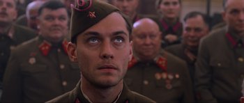 Movie still from “Enemy at the Gates” (2001), directed by Jean-Jacques Annaud – A group of men in uniform are standing in a room; Close Up shot, Low angle