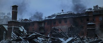 Movie still from “Enemy at the Gates” (2001), directed by Jean-Jacques Annaud – A building that has been destroyed in the middle of the night; Extreme Wide shot, Low angle