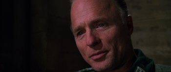 Movie still from “Enemy at the Gates” (2001), directed by Jean-Jacques Annaud – A man's face in the dark; Close Up shot, Over the shoulder angle