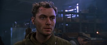 Movie still from “Enemy at the Gates” (2001), directed by Jean-Jacques Annaud – A person wearing a jacket; Close Up shot, Low angle