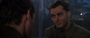 Movie still from “Enemy at the Gates” (2001), directed by Jean-Jacques Annaud – A man looking at himself in the mirror; Close Up shot, Over the shoulder angle