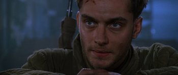 Movie still from “Enemy at the Gates” (2001), directed by Jean-Jacques Annaud – A person with a knife in his hand; Close Up shot, Low angle