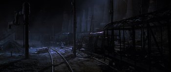 Movie still from “Enemy at the Gates” (2001), directed by Jean-Jacques Annaud – A train yard with a train on the tracks; Extreme Wide shot, High angle