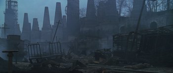 Movie still from “Enemy at the Gates” (2001), directed by Jean-Jacques Annaud – An abandoned city in the middle of the night; Extreme Wide shot, High angle