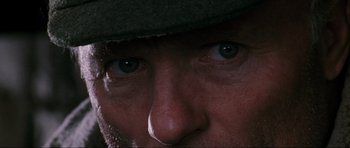 Movie still from “Enemy at the Gates” (2001), directed by Jean-Jacques Annaud – A man's face with blue eyes; Extreme Close Up shot, High angle