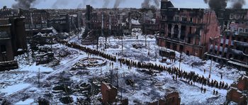 Movie still from “Enemy at the Gates” (2001), directed by Jean-Jacques Annaud – An aerial view of a city in the snow; Extreme Wide shot, High angle