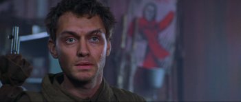 Movie still from “Enemy at the Gates” (2001), directed by Jean-Jacques Annaud – A person wearing a jacket; Close Up shot, Low angle