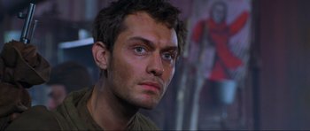 Movie still from “Enemy at the Gates” (2001), directed by Jean-Jacques Annaud – A person looking at the camera; Close Up shot, Low angle