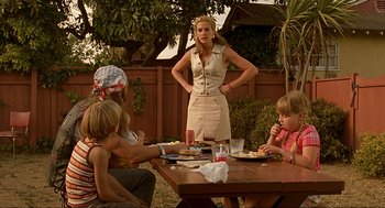 Movie still from “Erin Brockovich” (2000), directed by Steven Soderbergh – A group of people sitting at a picnic table; Medium shot, Over the shoulder angle