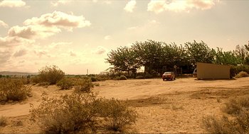 Movie still from “Erin Brockovich” (2000), directed by Steven Soderbergh – A car is parked in the middle of the desert; Extreme Wide shot, Low angle