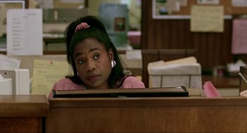 Movie still from “Erin Brockovich” (2000), directed by Steven Soderbergh – A woman sitting at a desk in front of a computer monitor; Close Up shot, Over the shoulder angle