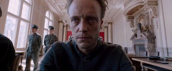 Movie still from “A Hidden Life” (2019), directed by Terrence Malick – A person wearing a shirt; Close Up shot, Low angle