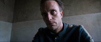 Movie still from “A Hidden Life” (2019), directed by Terrence Malick – A person looking at the camera; Close Up shot, Low angle