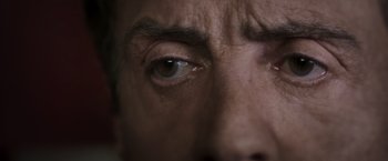 Movie still from “Escape Plan” (2013), directed by Mikael Håfström – A man's eye with a lot of wrinkles; Extreme Close Up shot, Low angle