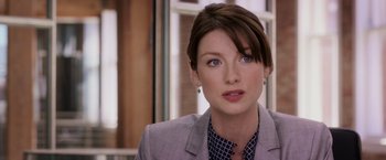 Movie still from “Escape Plan” (2013), directed by Mikael Håfström – A person wearing a suit and tie; Close Up shot, Over the shoulder angle