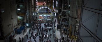 Movie still from “Escape Plan” (2013), directed by Mikael Håfström – A large group of people in a building; Extreme Wide shot, High angle